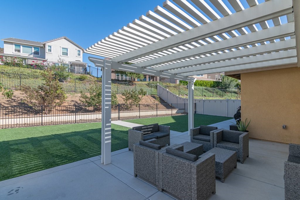 35851 Esperia Way Fallbrook, CA 92028 - Photo 21 of 28 a view of a patio with couches chairs and a big yard