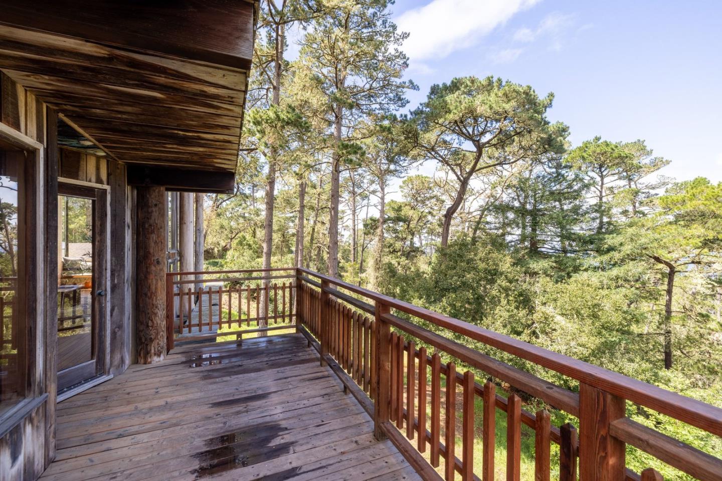 73 Mt Devon Road Carmel Highlands, CA 93923 - Photo 10 of 88 a view of balcony with wooden floor and outdoor space