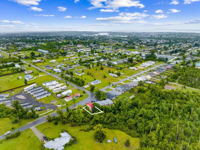 a view of hallway with wooden floor