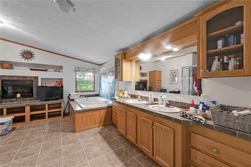 3942 Utah Court Export, PA 15632 - Photo 13 of 24 a large kitchen with a large counter top furniture and stainless steel appliances