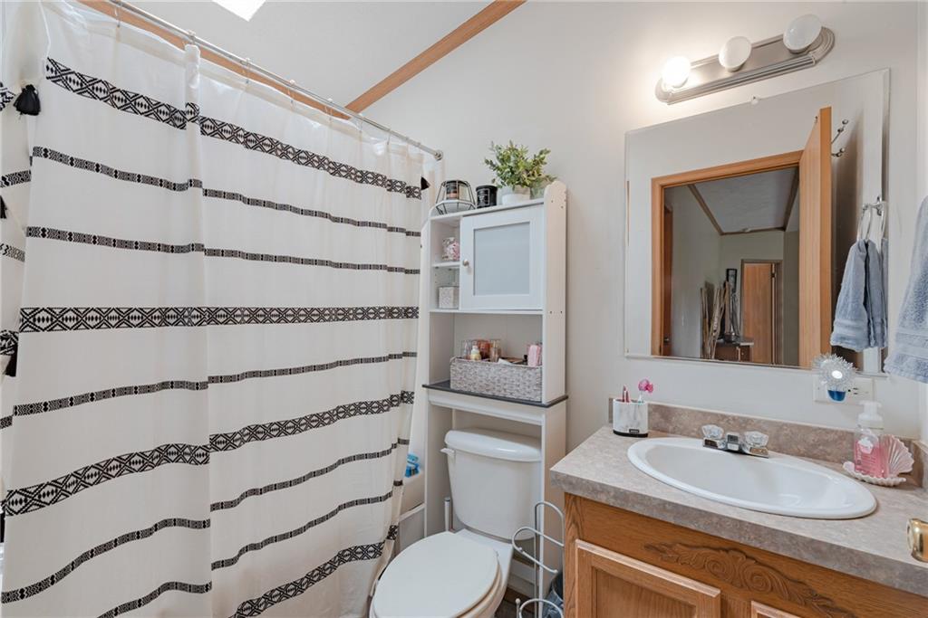 3942 Utah Court Export, PA 15632 - Photo 17 of 24 a bathroom with a granite countertop sink mirror vanity and toilet