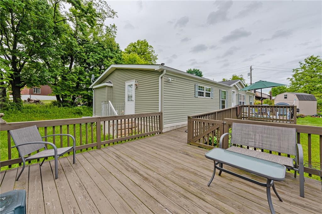 3942 Utah Court Export, PA 15632 - Photo 21 of 24 a terrace of a house with wooden floor outdoor seating and yard in the back