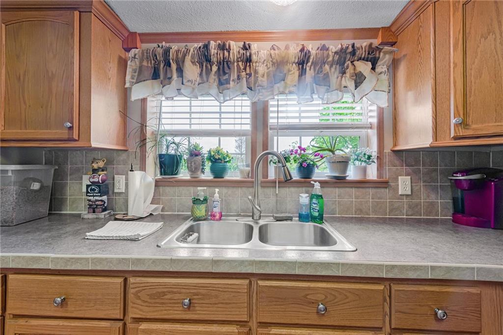 3942 Utah Court Export, PA 15632 - Photo 5 of 24 a kitchen with a sink and wooden floor