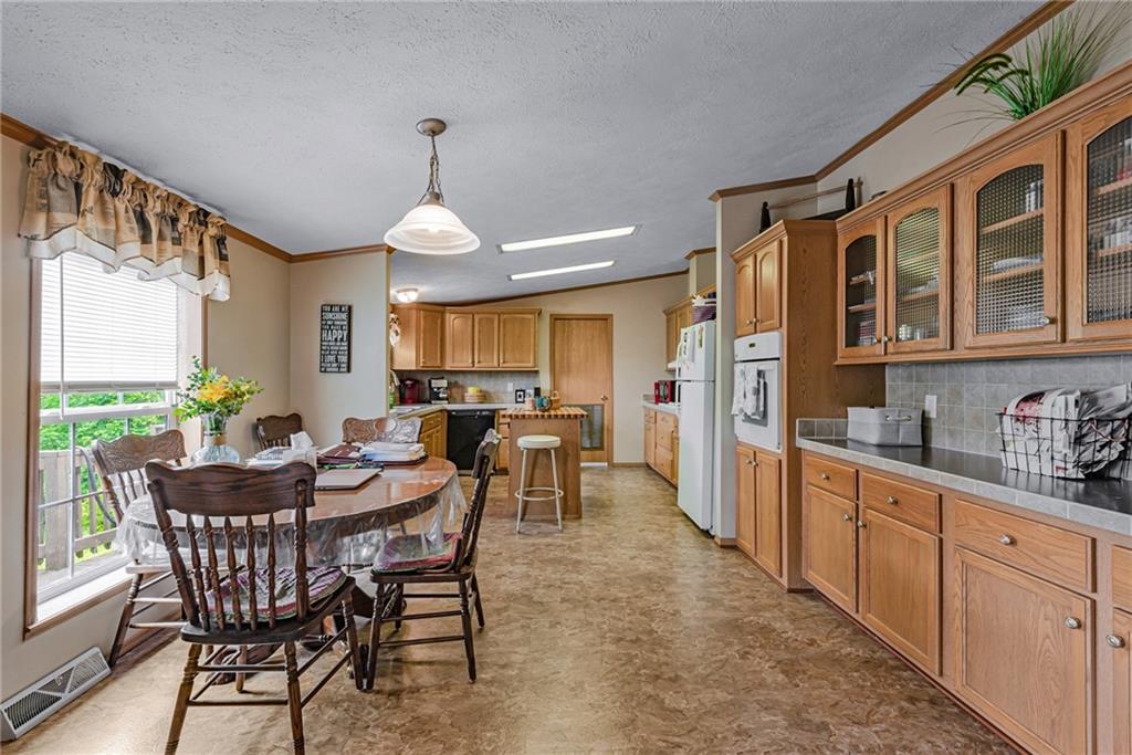 3942 Utah Court Export, PA 15632 - Photo 7 of 24 a view of a dining room with furniture window and wooden floor