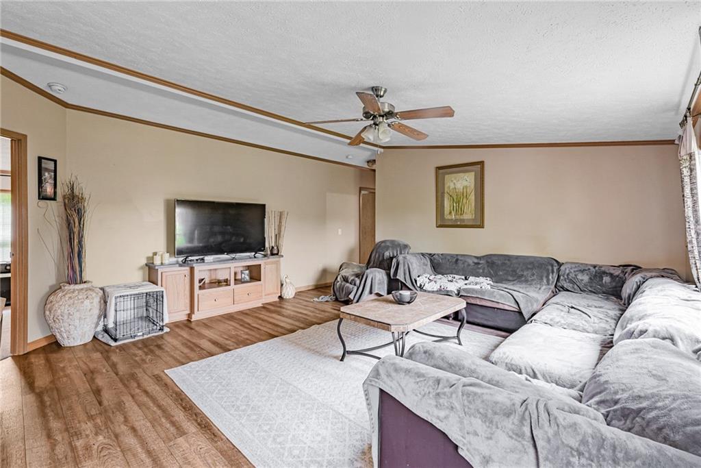 3942 Utah Court Export, PA 15632 - Photo 10 of 24 a living room with furniture and a flat screen tv