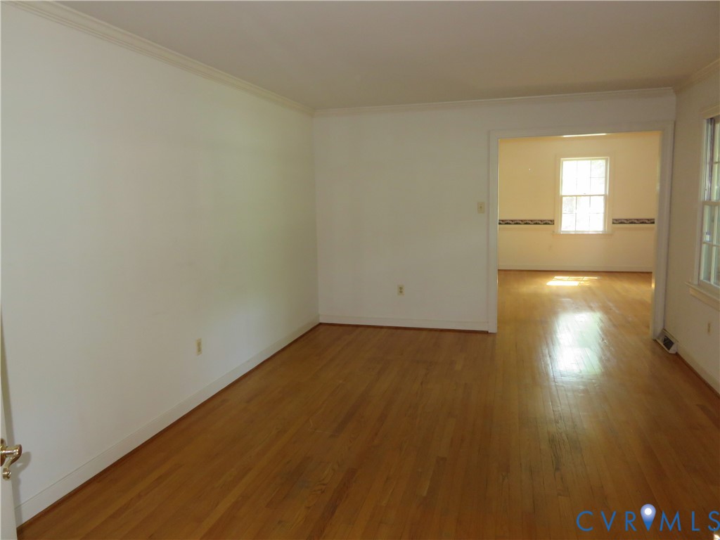8379 Quailfield Road Mechanicsville, VA 23116 - Photo 15 of 56 a view of empty room with wooden floor