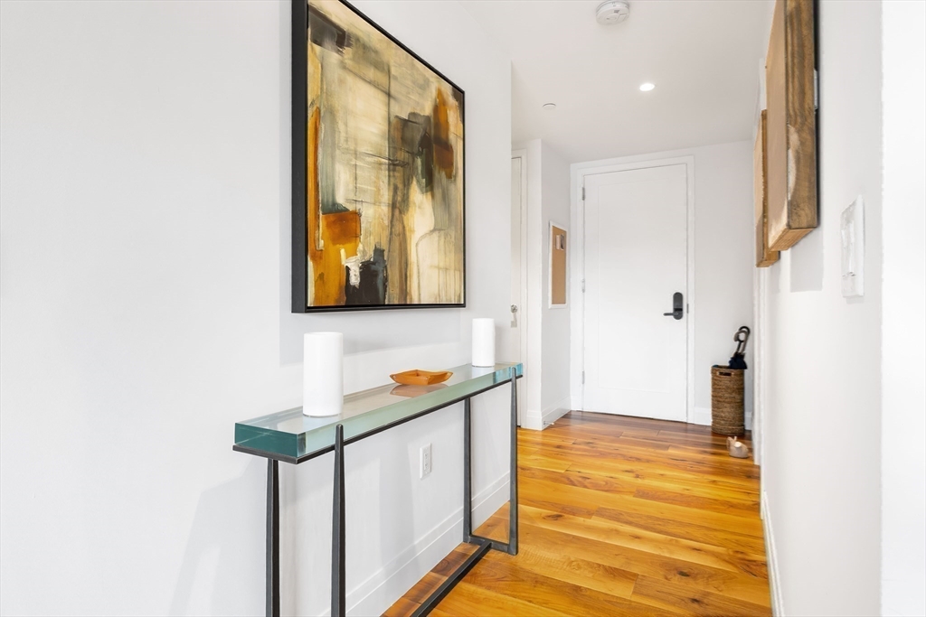 300 Pier 4 Blvd., Unit 3K Boston, MA 02210 - Photo 17 of 24 a bathroom with a sink and a mirror