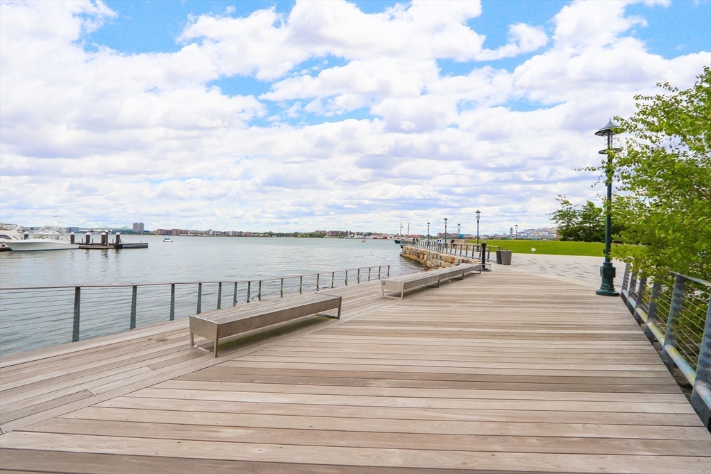 300 Pier 4 Blvd., Unit 3K Boston, MA 02210 - Photo 24 of 24 a view of roof deck with outdoor seating and city view