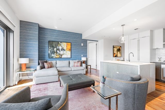 a living room with a couch and a large window