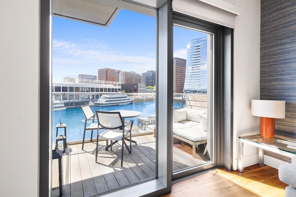 300 Pier 4 Blvd., Unit 3K Boston, MA 02210 - Photo 7 of 24 a view of a living room and a balcony
