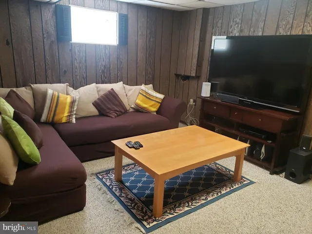 a living room with a couch and a flat screen tv