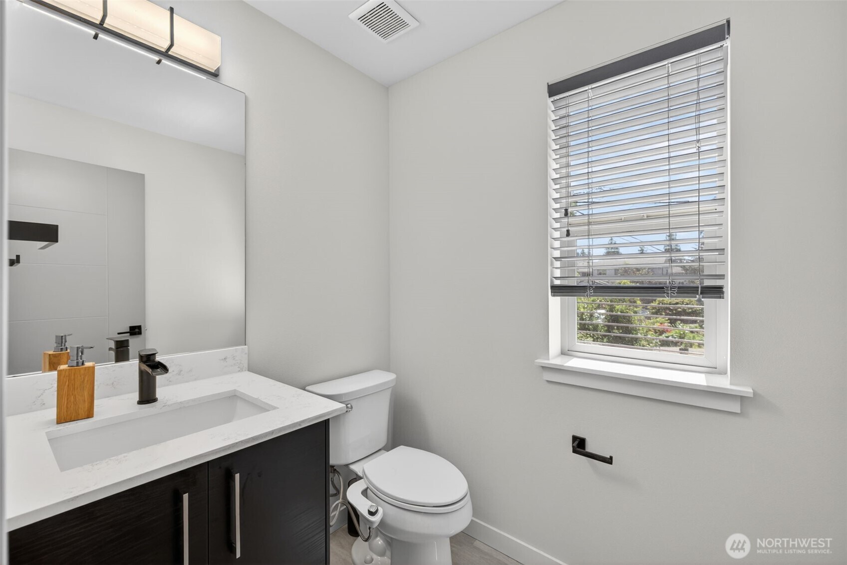 629 Bing Road, Unit B Lynnwood, WA 98036 - Photo 5 of 27 a bathroom with a sink a toilet and a window