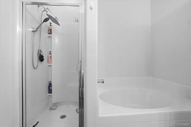 a living room with furniture a clock and a large window