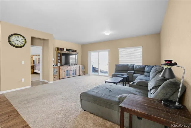 a living room with furniture and a table