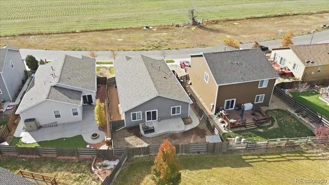 an aerial view of a house with a lake view