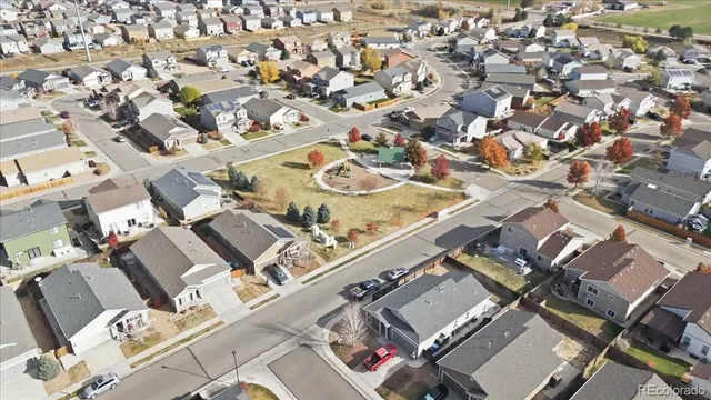 a picture of a bench in front of a building