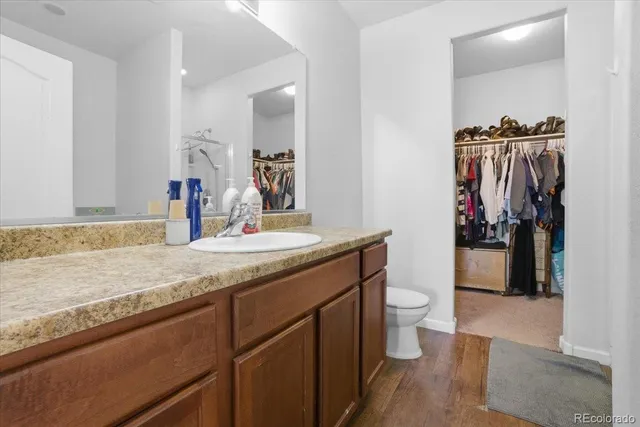 a white bath tub sitting next to a shower