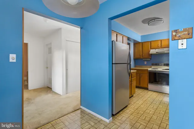 a view of a room with a ceiling fan