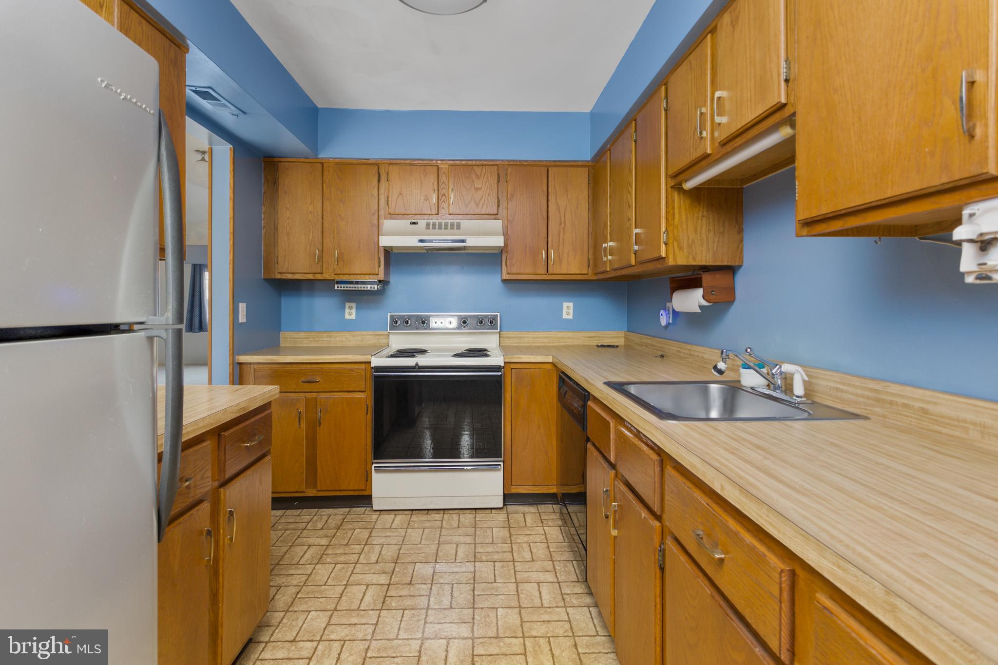 12 Jacob Court Ewing, NJ 08628 - Photo 3 of 45 a kitchen with a sink a stove top oven and cabinets
