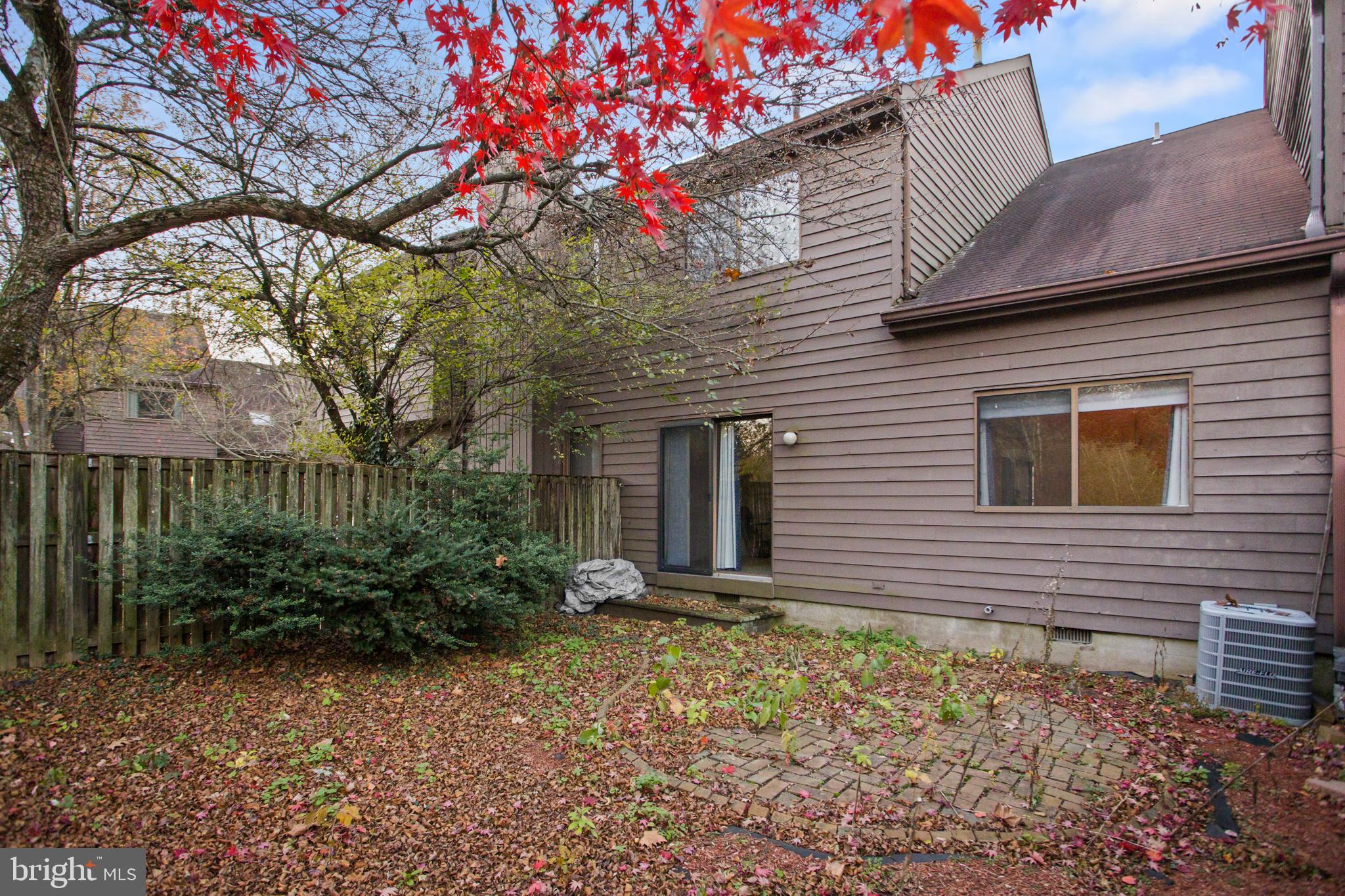 12 Jacob Court Ewing, NJ 08628 - Photo 37 of 45 a view of a house with brick walls and a large tree