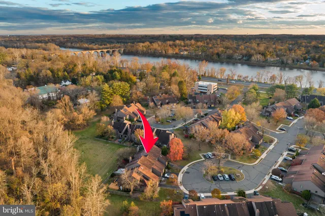 an aerial view of a house with a lake view