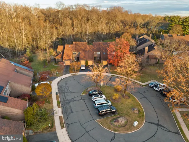 an aerial view of a house with a swimming pool