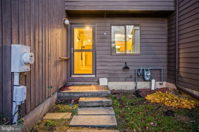 a front view of a house with glass windows