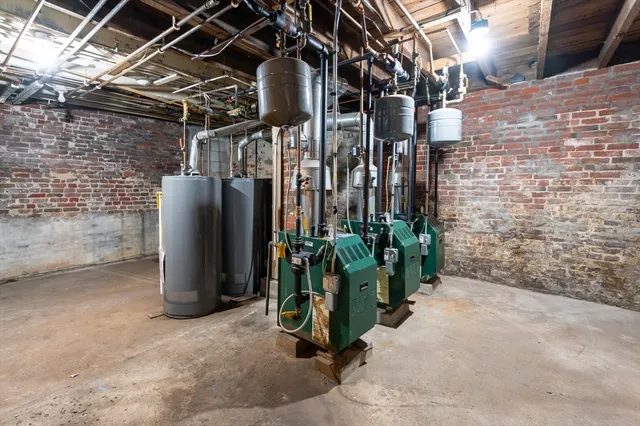 a view of a street with potted plants