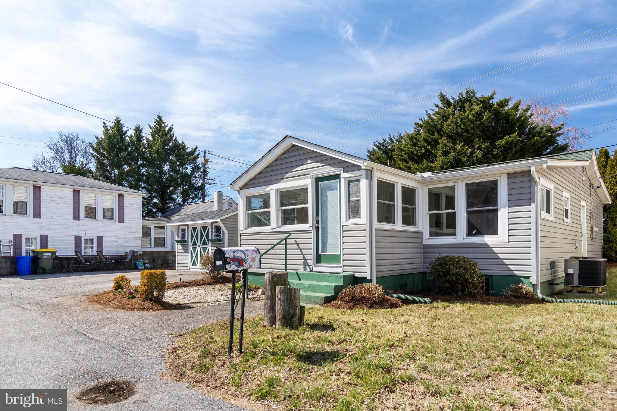 8227 Bayside Road Chesapeake Beach, MD 20732 - Photo 15 of 27 a front view of a house with garden