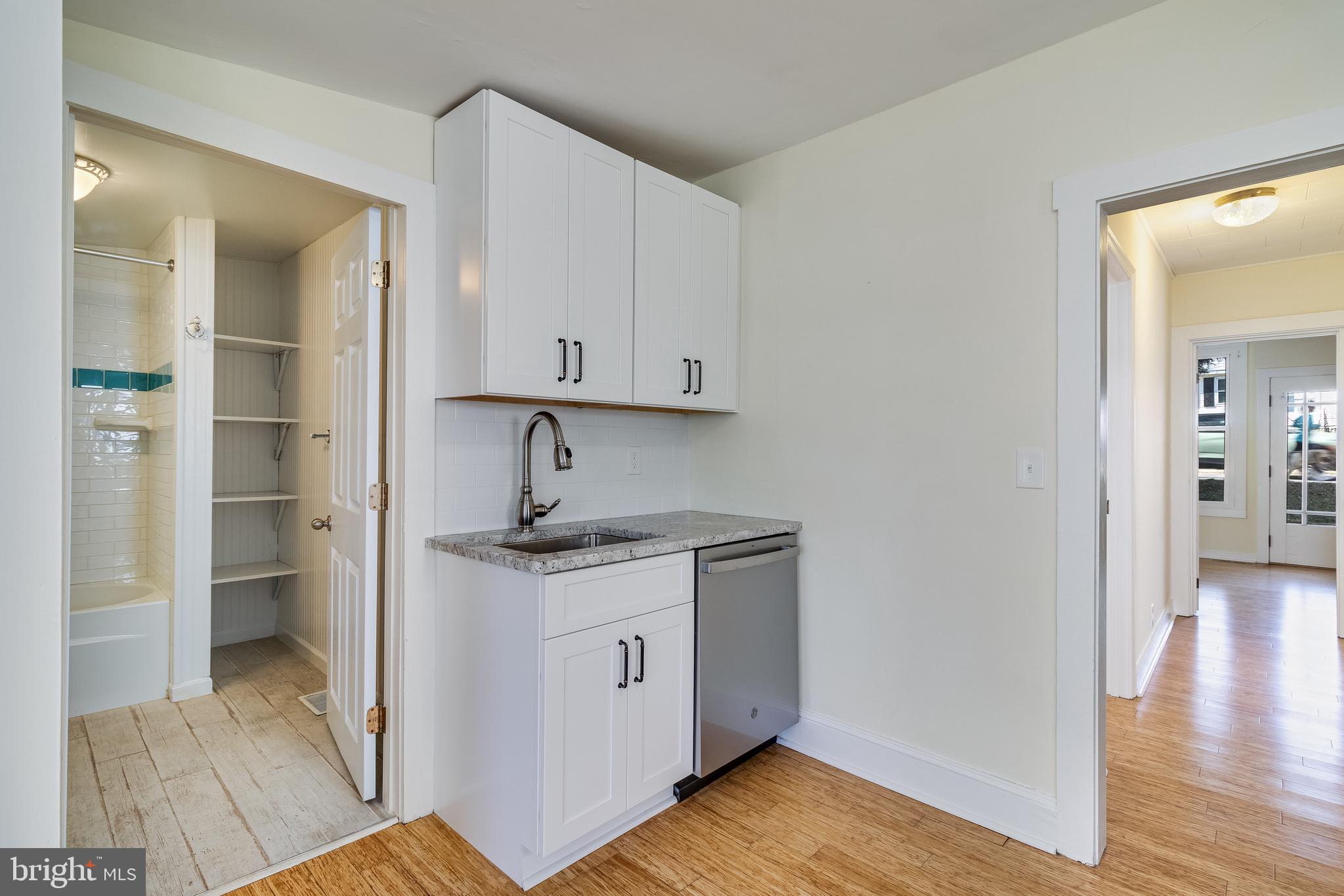 8227 Bayside Road Chesapeake Beach, MD 20732 - Photo 16 of 27 a view of a kitchen with a sink and dishwasher