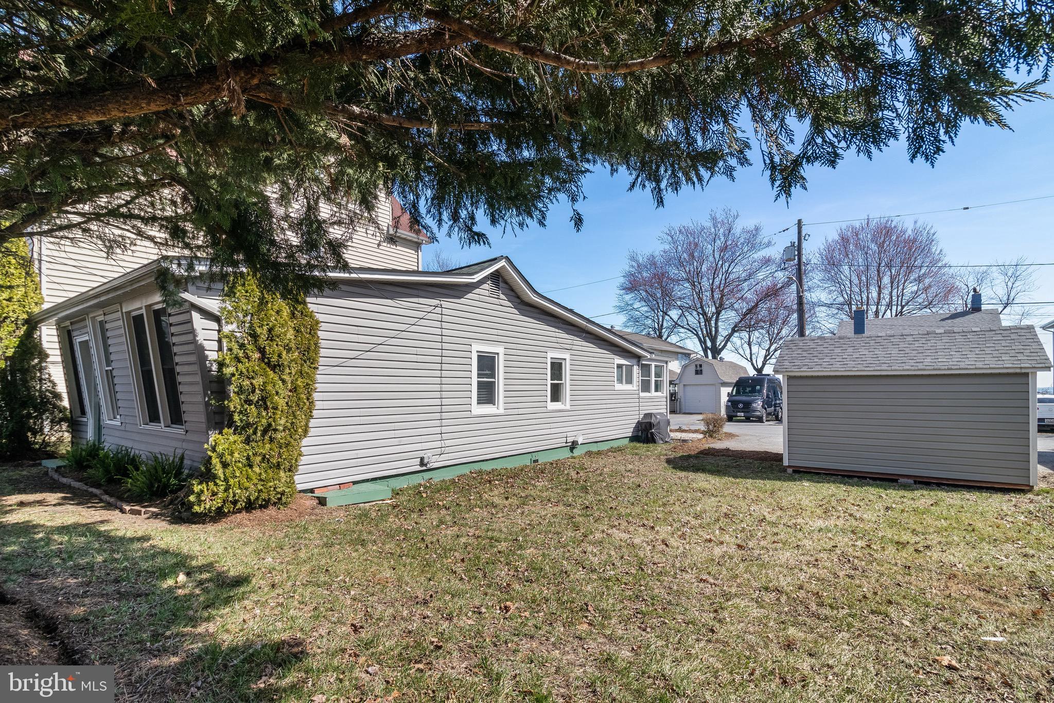 8227 Bayside Road Chesapeake Beach, MD 20732 - Photo 25 of 27 a view of a house with a yard and garage