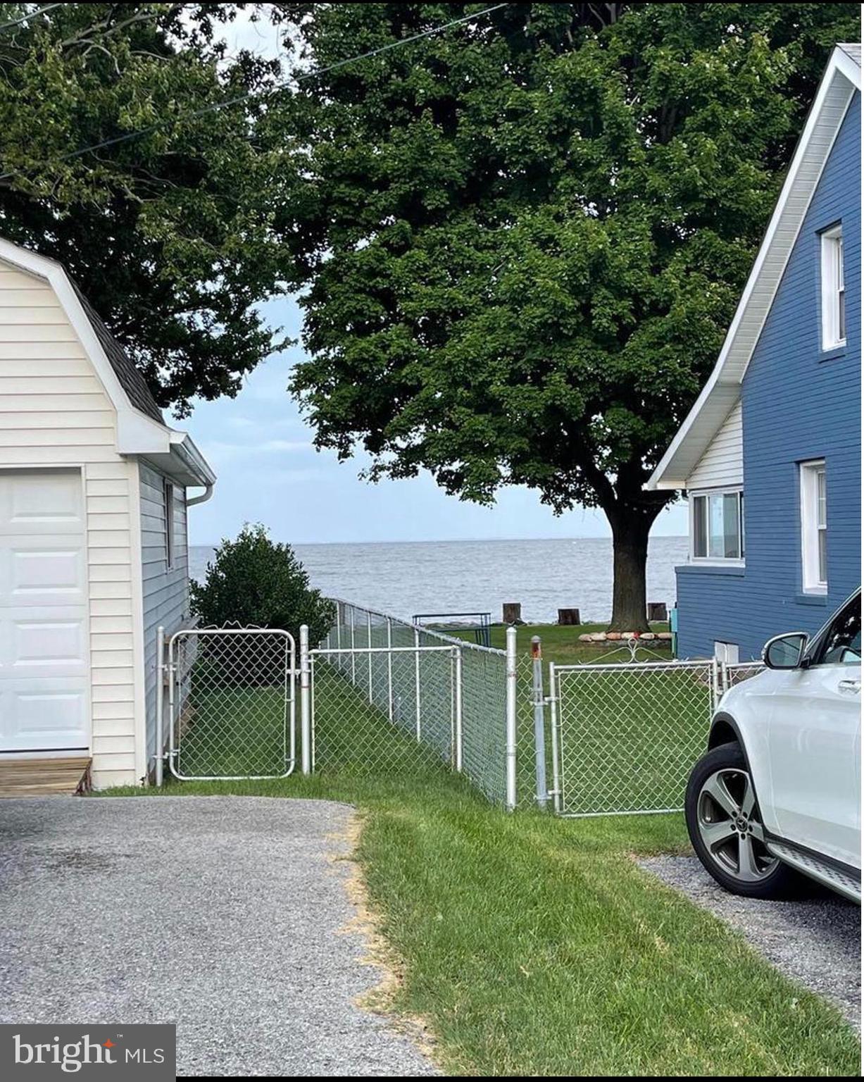 8227 Bayside Road Chesapeake Beach, MD 20732 - Photo 4 of 27 a view of a house with backyard