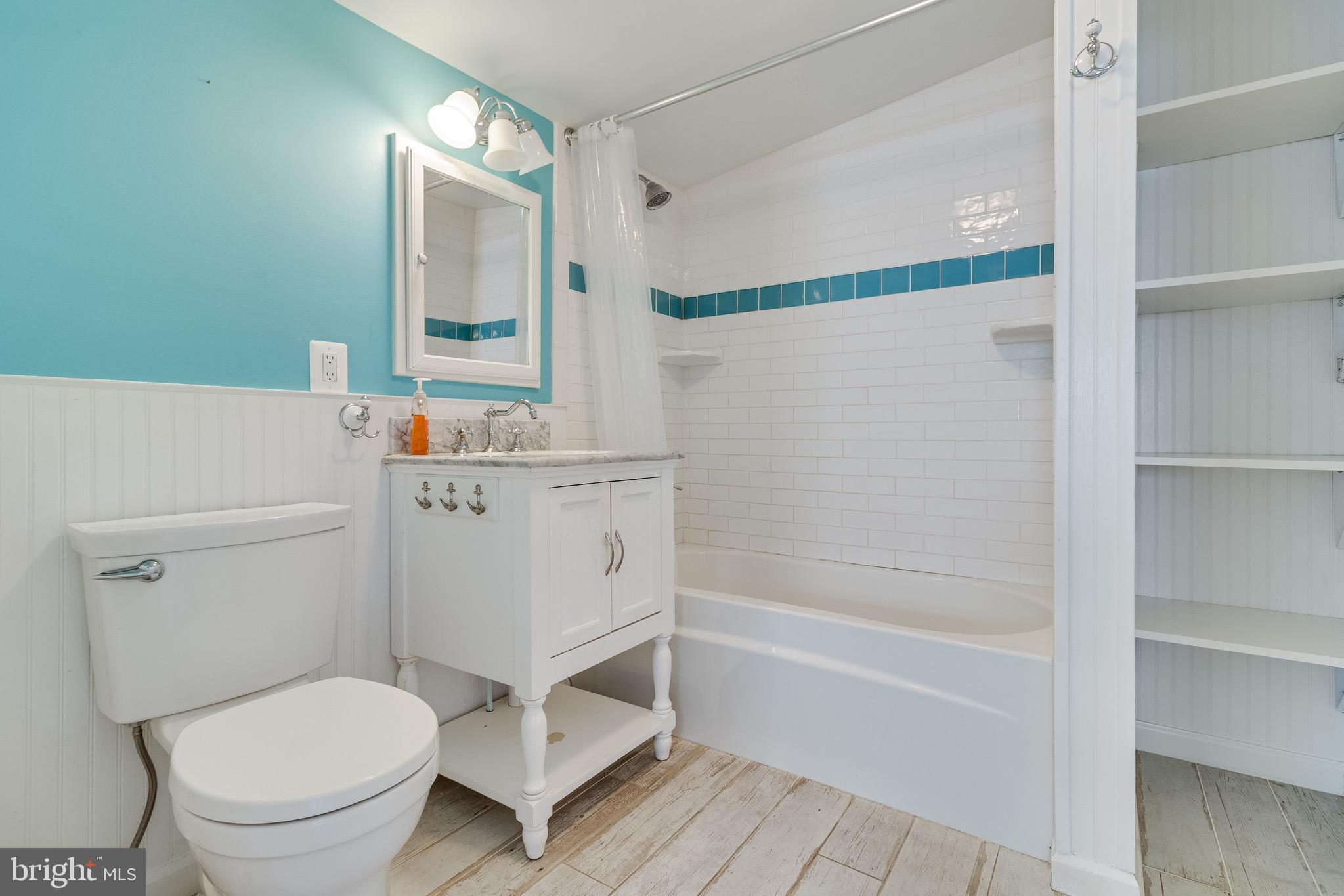 8227 Bayside Road Chesapeake Beach, MD 20732 - Photo 6 of 27 a white toilet sitting next to a bath tub