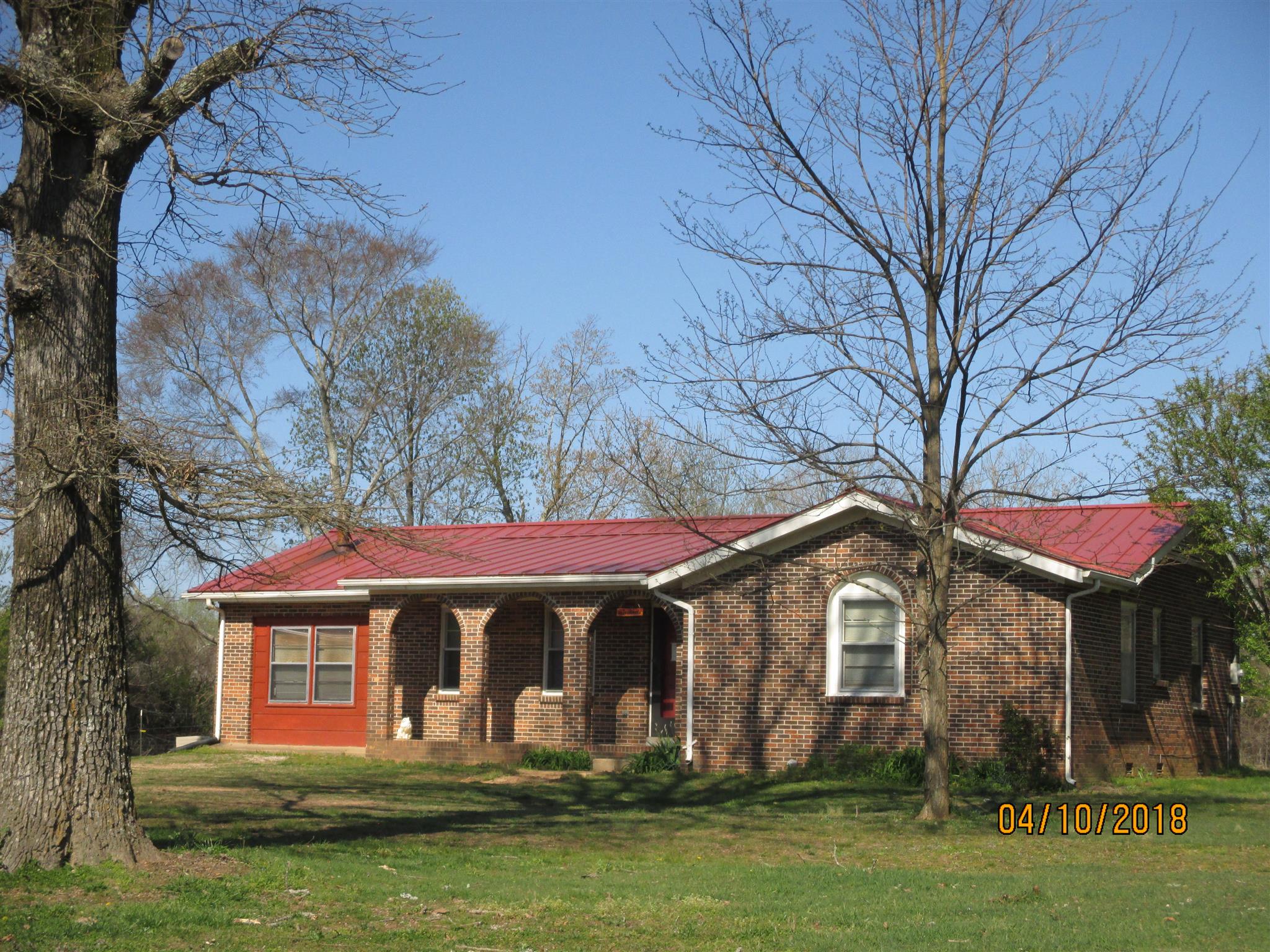 1468 Oak Grove Road Goodspring, TN 38460 - Photo 1 of 10 a front view of a house with a yard