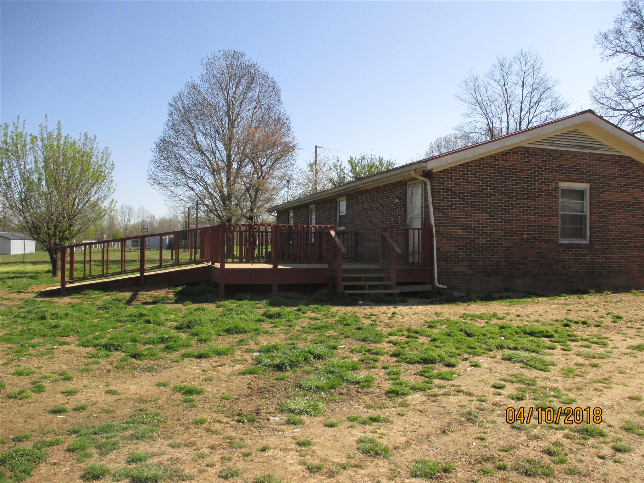 1468 Oak Grove Road Goodspring, TN 38460 - Photo 7 of 10 a house with trees in front of it