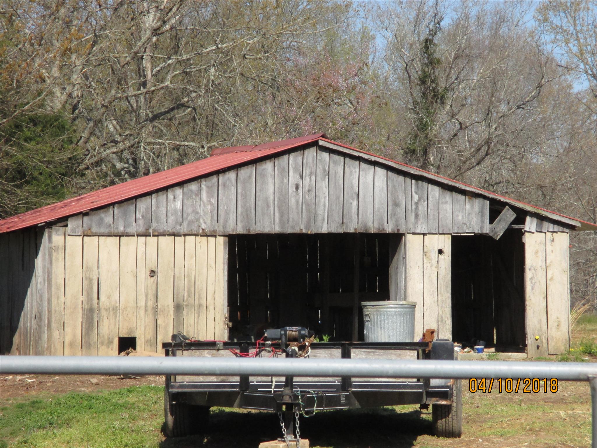 1468 Oak Grove Road Goodspring, TN 38460 - Photo 10 of 10 a backyard of a house with barbeque oven table and chairs