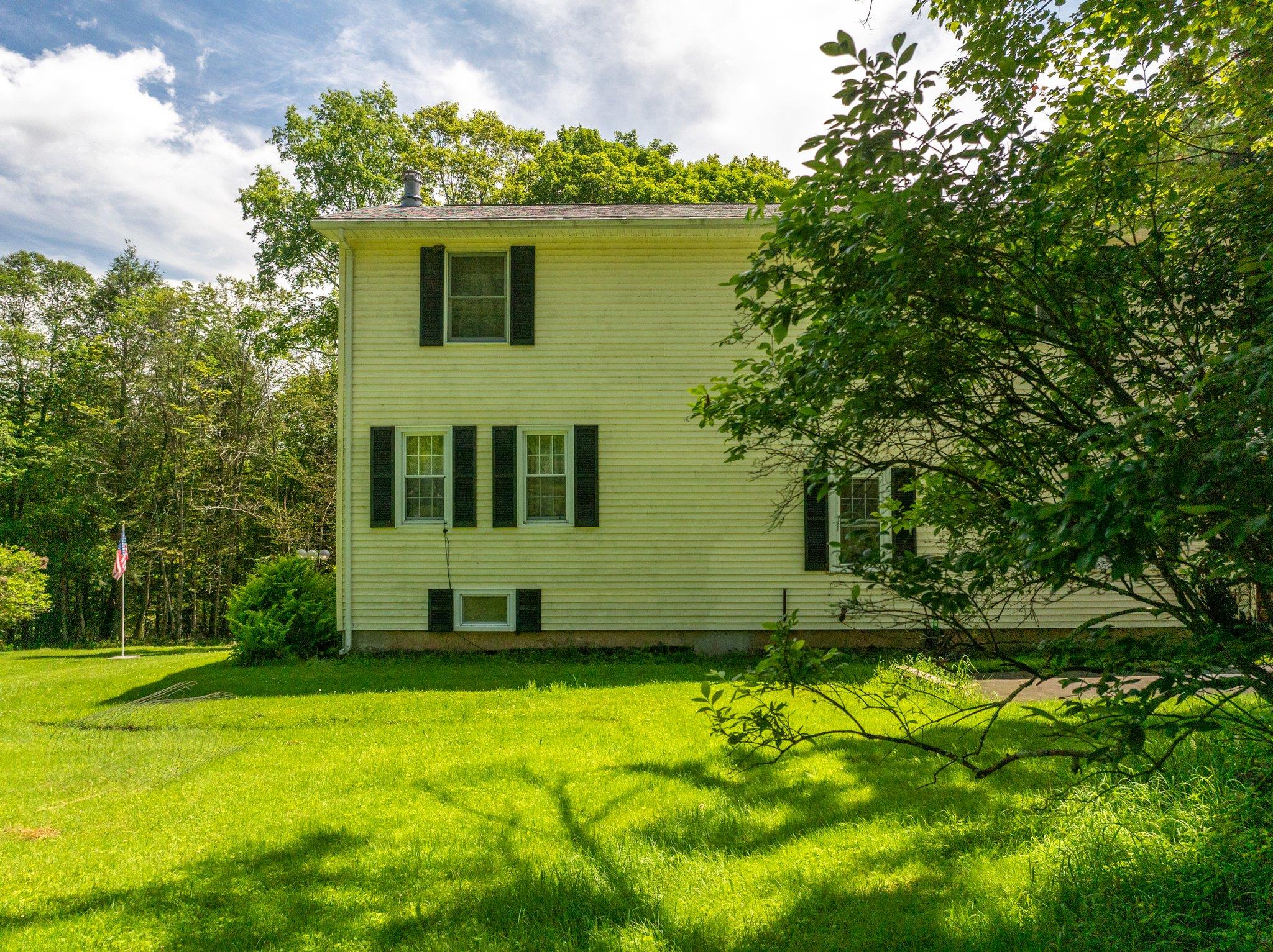 10 Hoffman Road Hankins, NY 12741 - Photo 2 of 30 a front view of a house with a yard