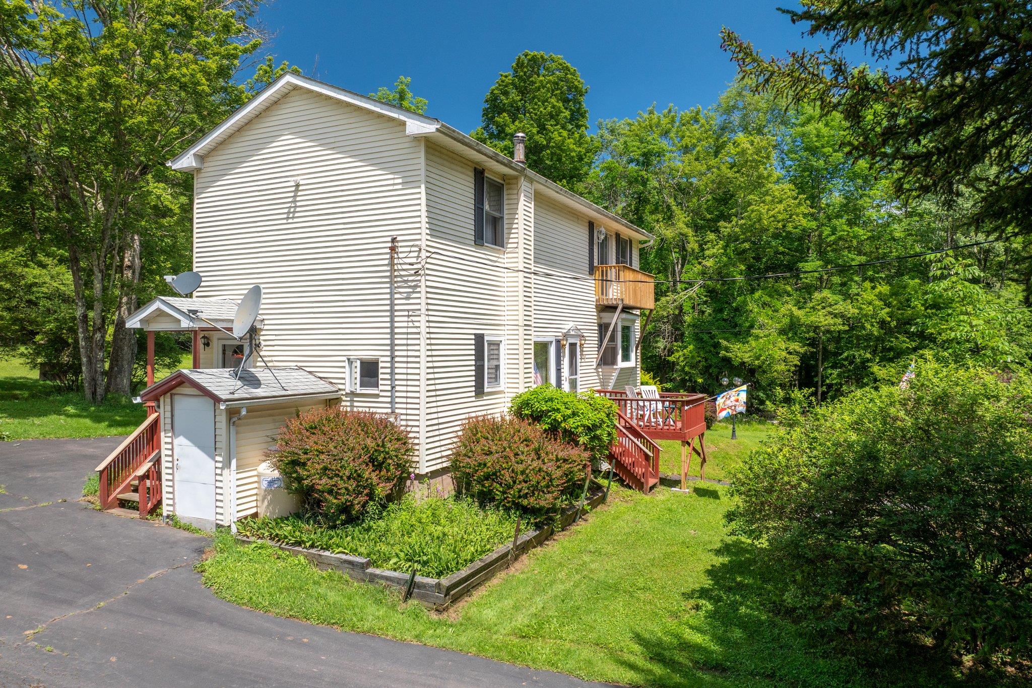 10 Hoffman Road Hankins, NY 12741 - Photo 22 of 30 a view of a house with backyard and garden