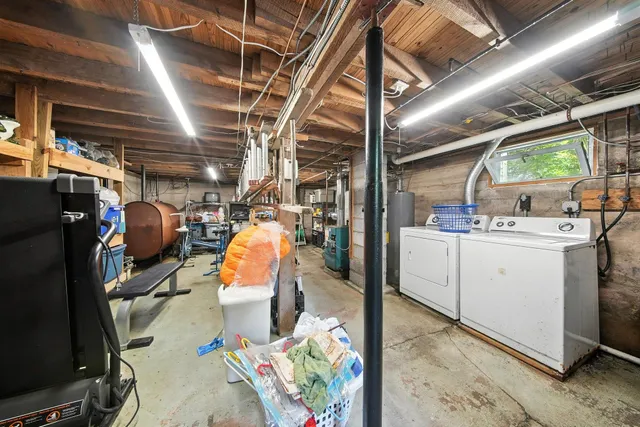 a view of deck with furniture and trees around