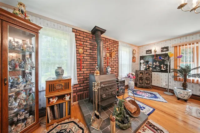 a view of a livingroom with workspace and a window
