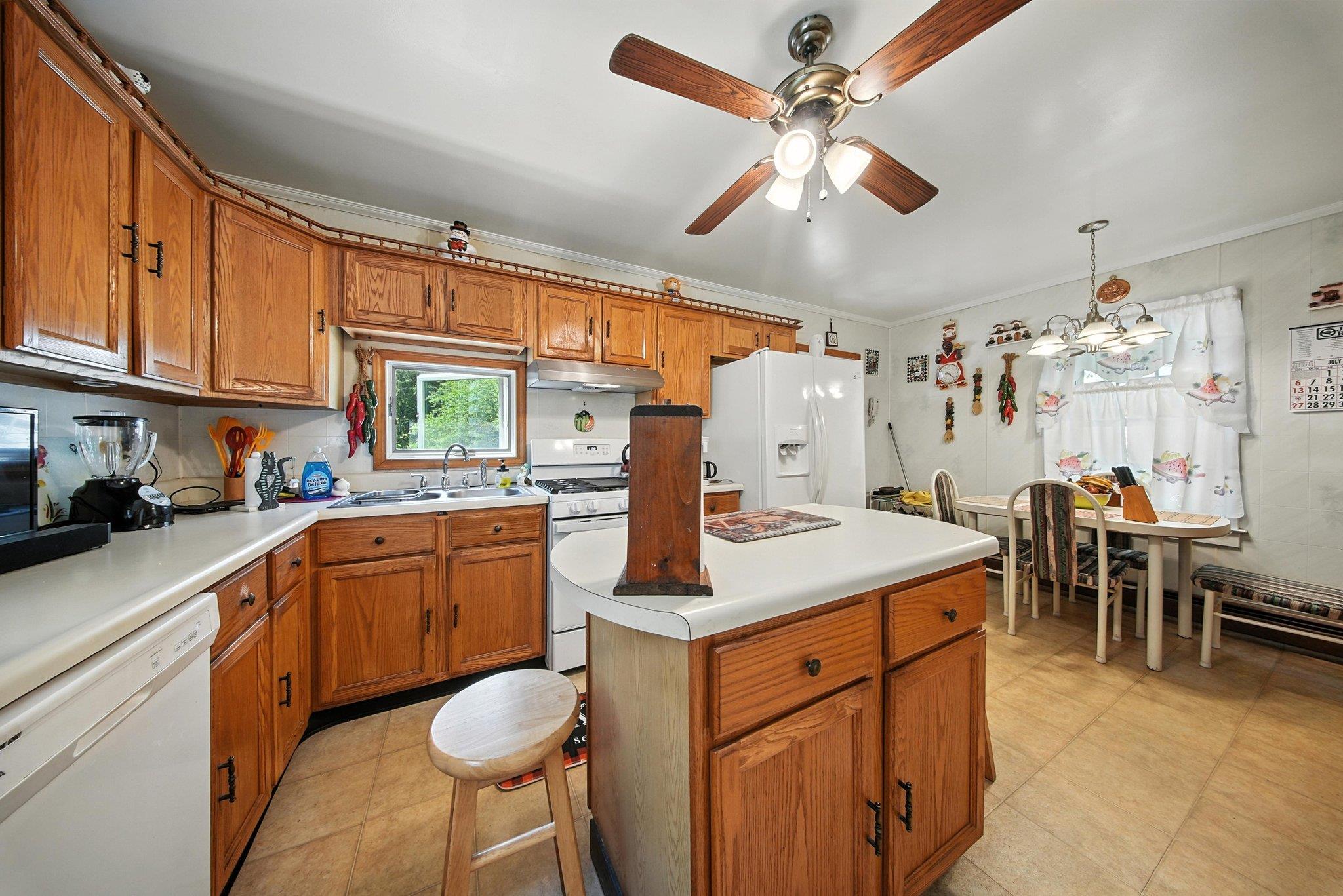 10 Hoffman Road Hankins, NY 12741 - Photo 10 of 30 a kitchen with cabinets a sink appliances and a dining table