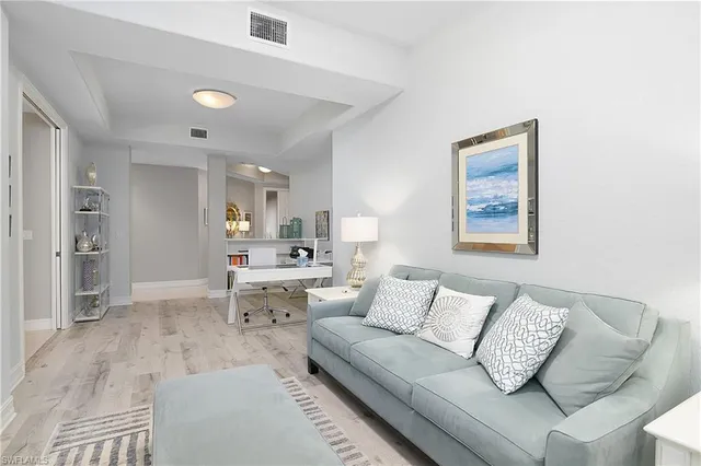 a living room with furniture and a couch