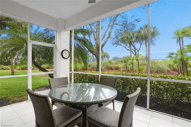 a view of a chairs and table in patio yard