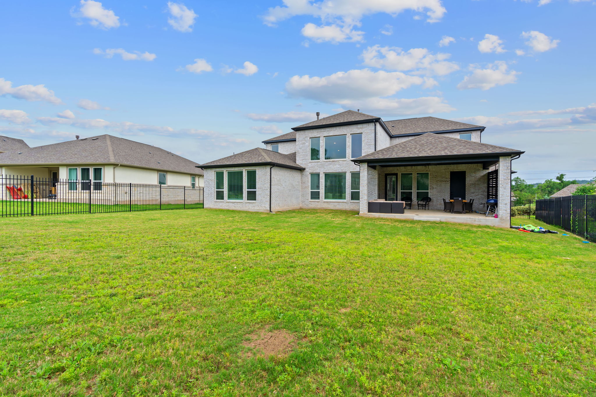 309 Pear Tree Lane Austin, TX 78737 - Photo 39 of 39 a front view of a house with garden