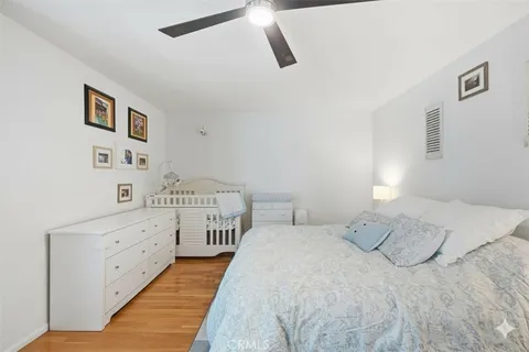 a bedroom with a bed and a cabinets