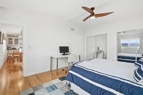 a bedroom with a bed and a view of bathroom