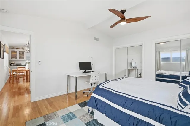 a bedroom with a bed and a view of bathroom
