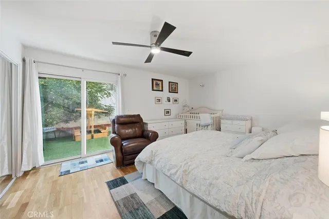 a bed room with two beds and a large window