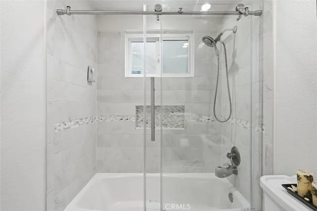 a bathroom with a shower and a bathtub