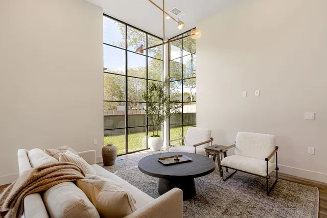 a living room with furniture and a table